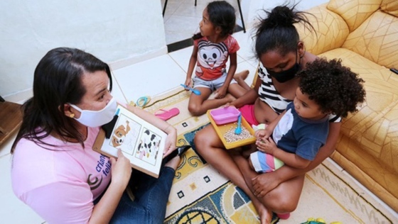 Photo of social workers visiting children and their families at their homes